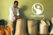 Man holding coffee beans with Fairtrade logo